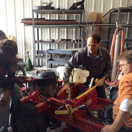 Harrold making modifications to the  Zero-Turn Ranch Truck.