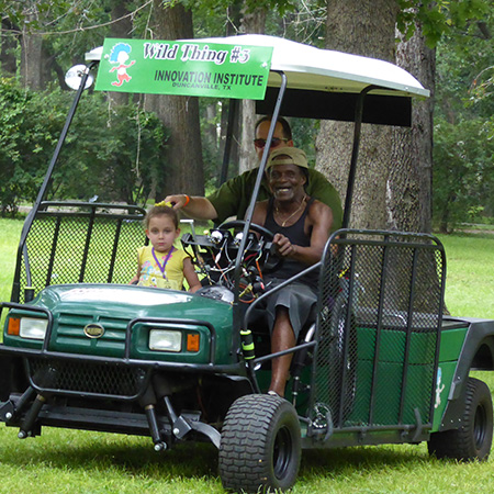 Tommie giving rides on the Green Kart.