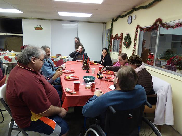Friends of the Institute enjoying food and fellowship at the Christmas party.