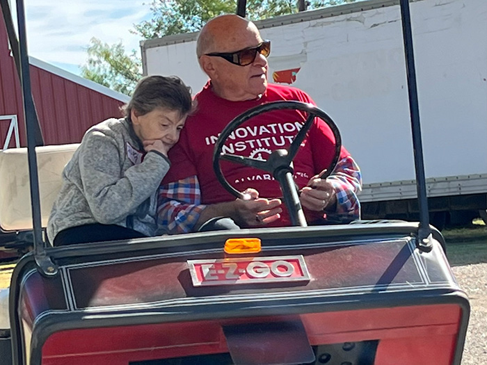 Man & daughter on cart