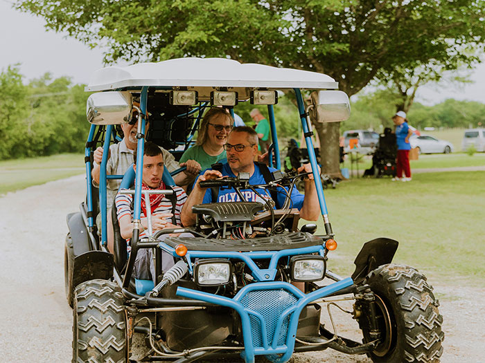 Kids enjoying blue cart ride