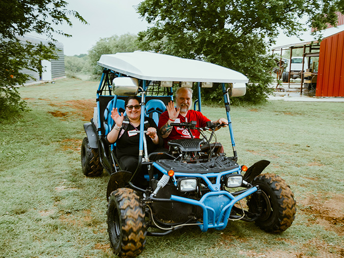 People in blue cart
