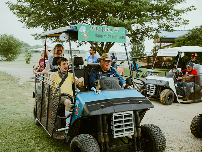 People riding in cart