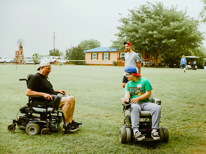 Two guys in power chairs