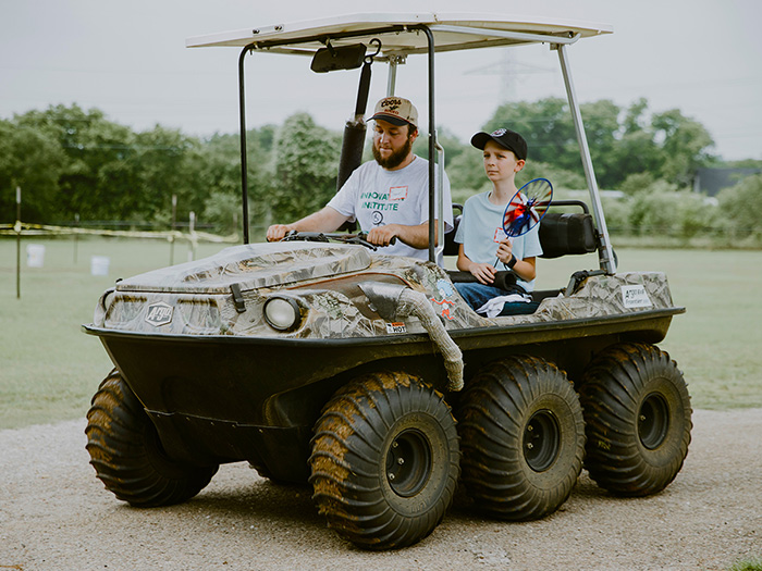 Two guys on 6 wheel cart