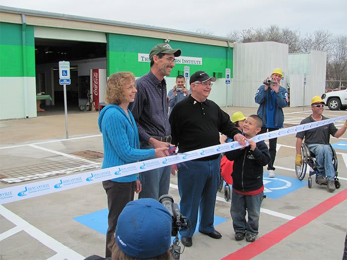 Harrold and Nancy cutting ribbon during Grand Opening ceremony.