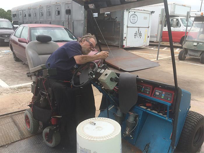 Jim adjusts controls on the Blue Hybrid Kart.